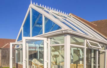 conservatory roof insulation costs Five Oaks